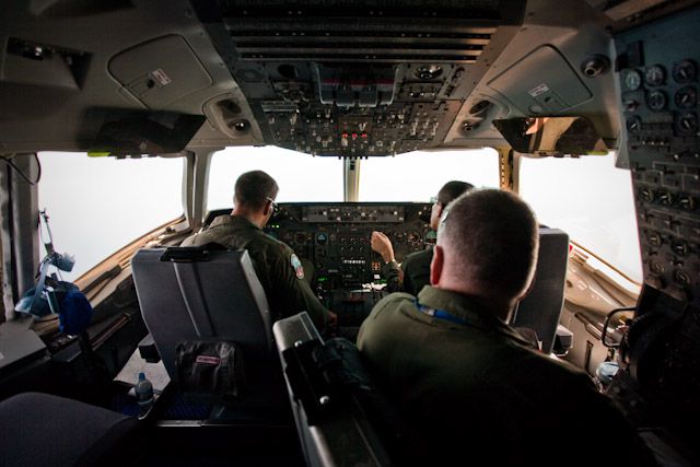 The cockpit of the KC-10 with the pilot, co-pilot and flight engineer.